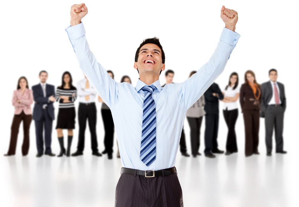 Businessman celebrating with arms up with his group - isolated over a white background